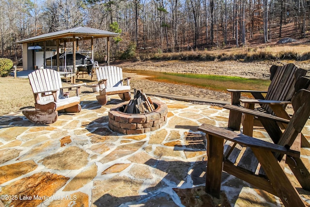 view of patio / terrace featuring an outdoor fire pit and a gazebo