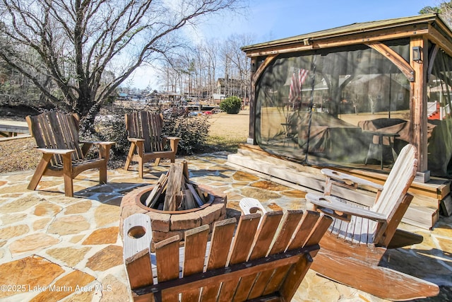 view of patio featuring a fire pit