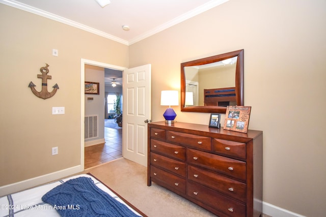 bedroom featuring light colored carpet and ornamental molding