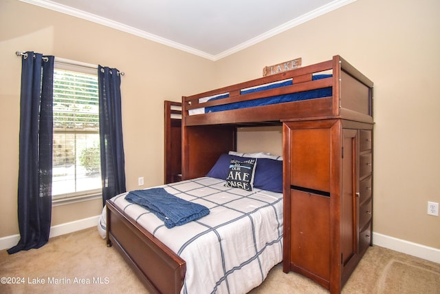 bedroom featuring light carpet and ornamental molding