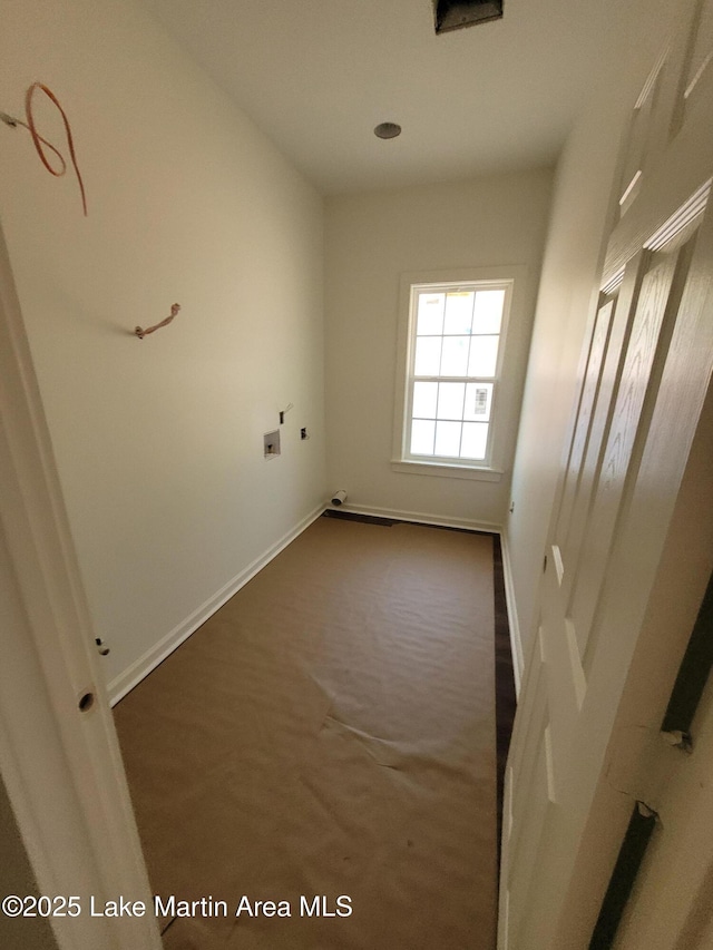 214 Mccain Rd, Eclectic, AL 36024 - spare room with baseboards and dark carpet