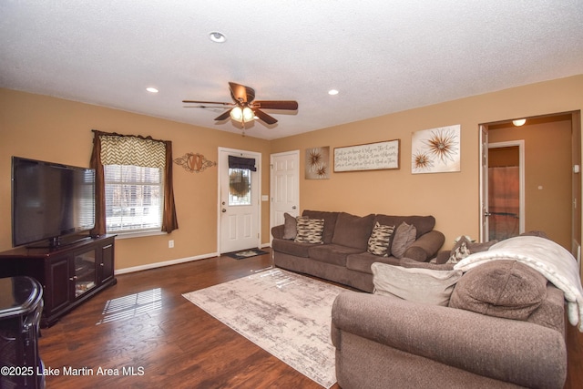 living area featuring recessed lighting, ceiling fan, baseboards, and dark wood-style flooring