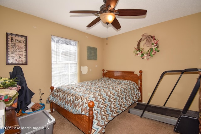 carpeted bedroom with a ceiling fan