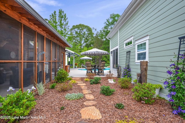 24 Hideaway Cir, Jacksons Gap, AL 36861 - view of yard with a patio area and a sunroom