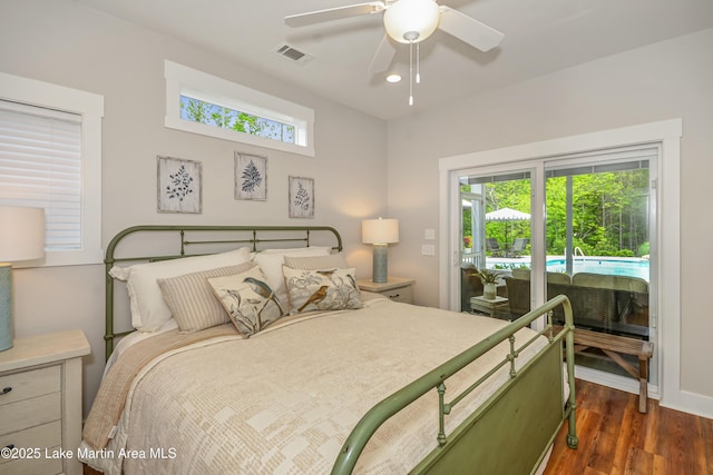 24 Hideaway Cir, Jacksons Gap, AL 36861 - bedroom with visible vents, dark wood-style flooring, baseboards, access to outside, and a ceiling fan