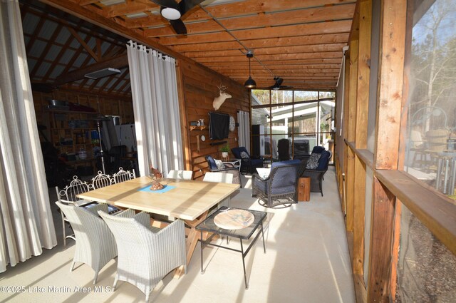 sunroom featuring vaulted ceiling