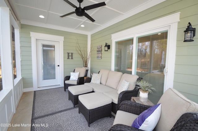 sunroom featuring ceiling fan