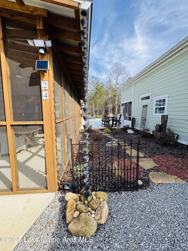 view of side of property featuring a patio