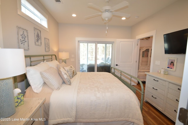 bedroom with dark hardwood / wood-style floors and ceiling fan