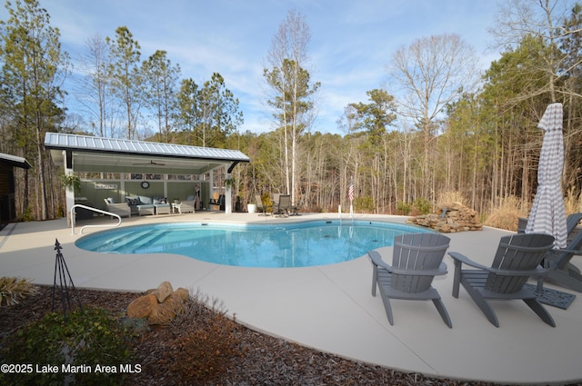 view of pool featuring an outdoor living space, a gazebo, and a patio area