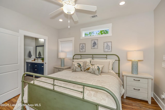 24 Hideaway Cir, Jacksons Gap, AL 36861 - bedroom with baseboards, recessed lighting, wood finished floors, and visible vents
