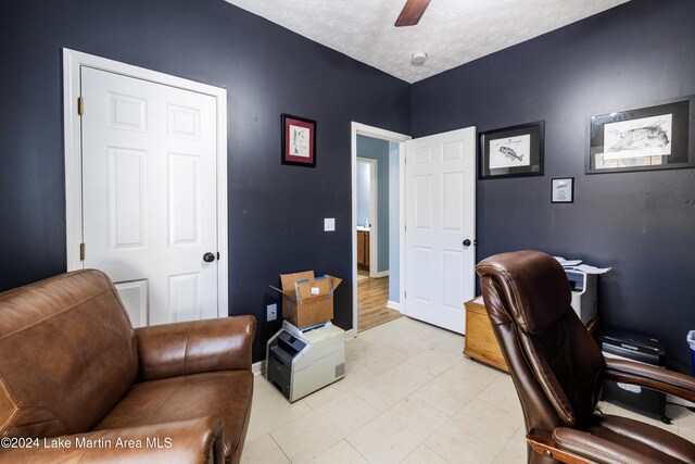 office space with ceiling fan and a textured ceiling