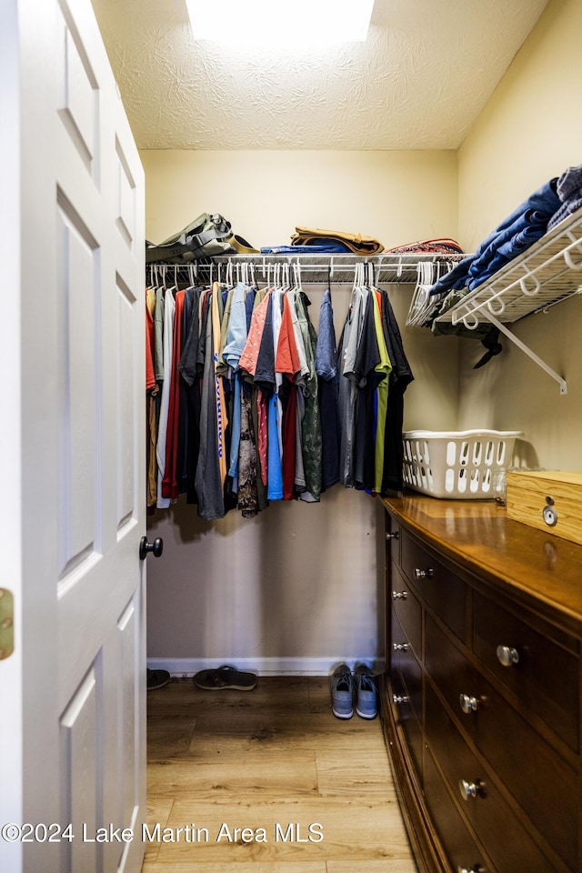 walk in closet featuring hardwood / wood-style floors