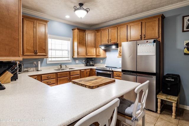 kitchen featuring a kitchen bar, appliances with stainless steel finishes, ornamental molding, sink, and light tile patterned flooring