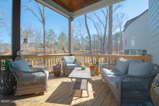 deck featuring outdoor lounge area