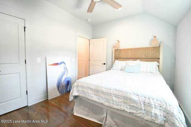 bedroom featuring ceiling fan, vaulted ceiling, and wood finished floors