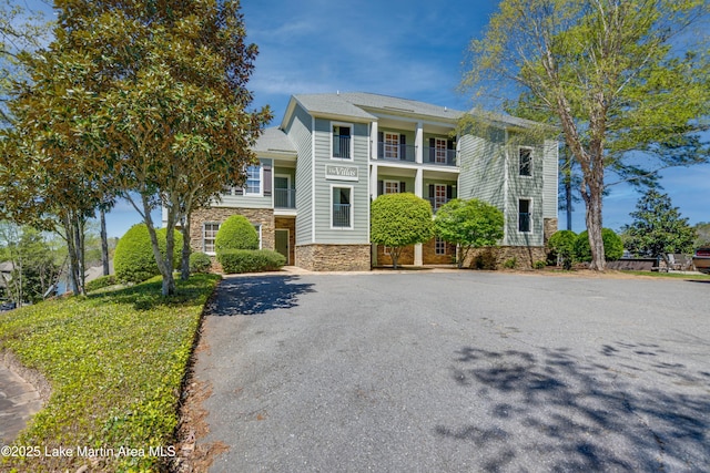 110 Village Loop Unit A103, Dadeville, AL 36853 - view of front of home with stone siding and a balcony