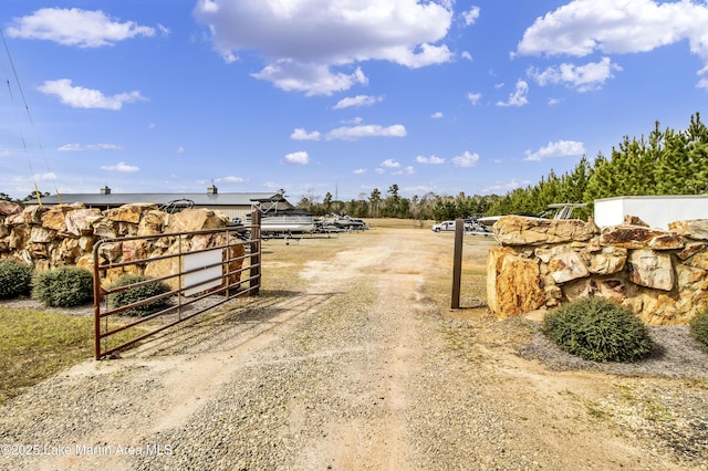 110 Village Loop Unit A103, Dadeville, AL 36853 - view of dirt / gravel road featuring a gated entry