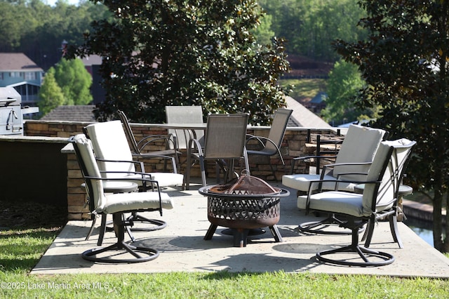 110 Village Loop Unit A103, Dadeville, AL 36853 - view of patio featuring an outdoor fire pit
