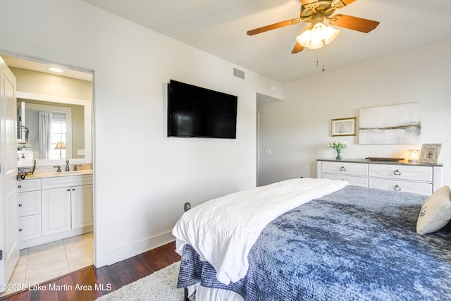 110 Village Loop Unit A103, Dadeville, AL 36853 - bedroom with light wood-type flooring, connected bathroom, and ceiling fan