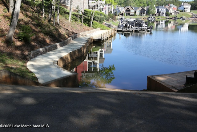 110 Village Loop Unit A103, Dadeville, AL 36853 - dock with a water view, a residential view, and a boat ramp