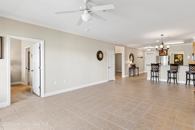 90 Crowne Pointe Rd, Dadeville, AL 36853 - unfurnished living room featuring light tile patterned floors, ornamental molding, ceiling fan with notable chandelier, and baseboards