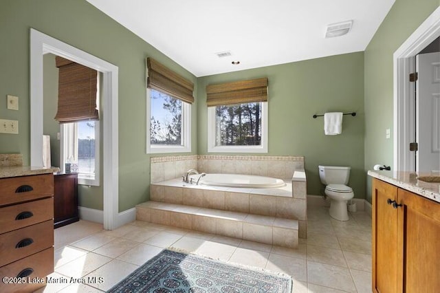 1689 River Oaks Dr, Jacksons Gap, AL 36861 - bathroom featuring plenty of natural light, baseboards, a bath, and vanity