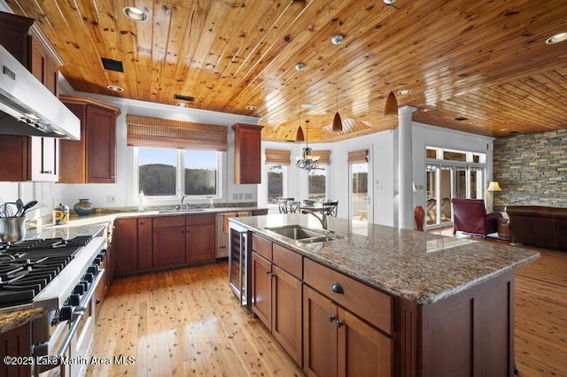 1689 River Oaks Dr, Jacksons Gap, AL 36861 - kitchen featuring a sink, wooden ceiling, stainless steel range, light wood-type flooring, and plenty of natural light