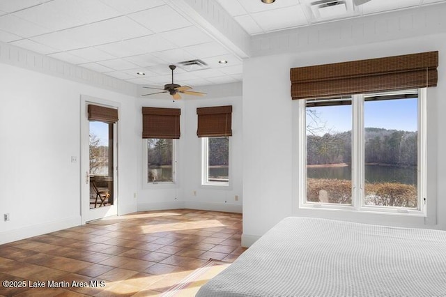 1689 River Oaks Dr, Jacksons Gap, AL 36861 - unfurnished bedroom featuring tile patterned floors, baseboards, and a ceiling fan