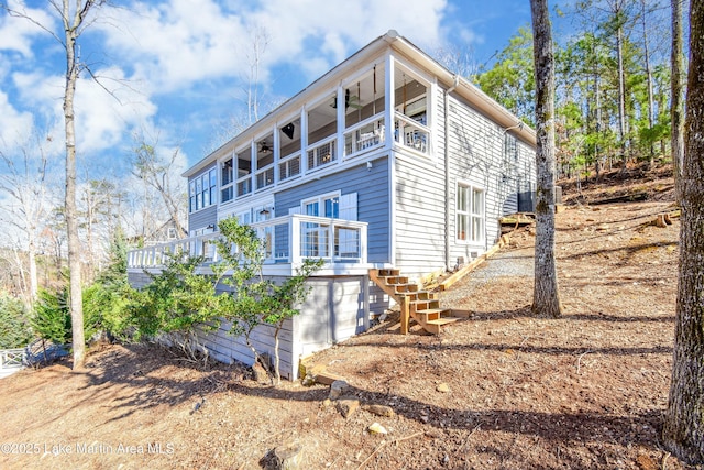 view of side of home with a deck