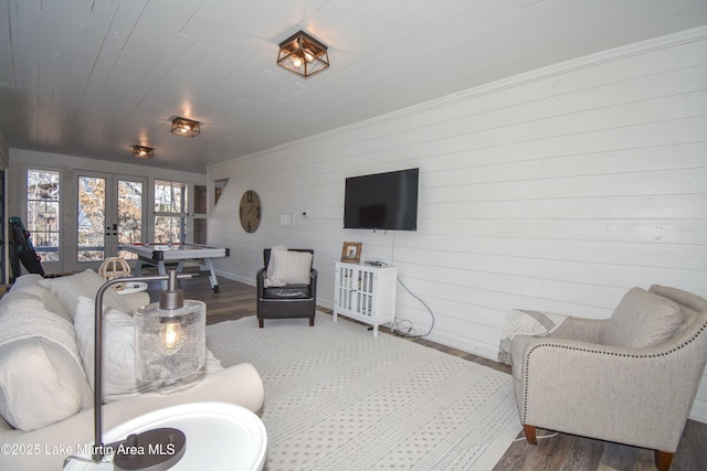 living room featuring hardwood / wood-style flooring, wood ceiling, and french doors