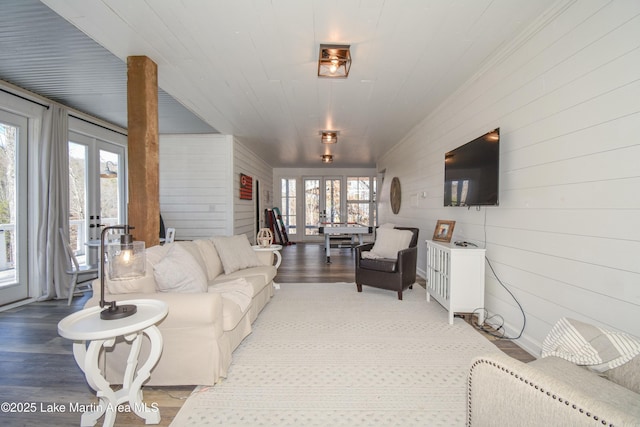 living room featuring french doors and hardwood / wood-style flooring