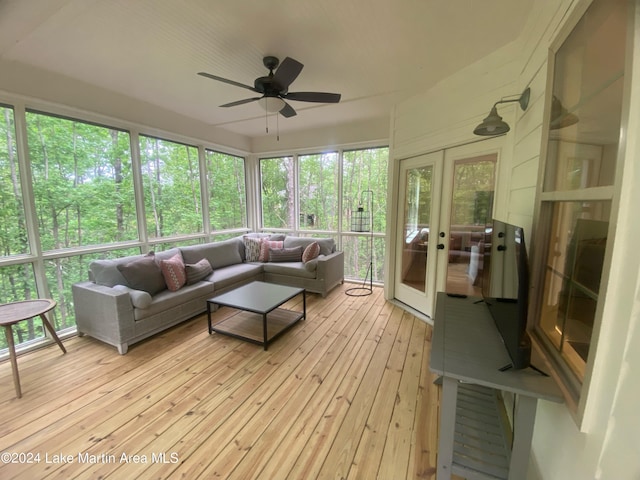 sunroom / solarium featuring french doors and ceiling fan