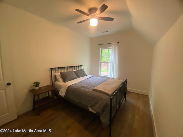 bedroom featuring vaulted ceiling, ceiling fan, and dark wood-type flooring