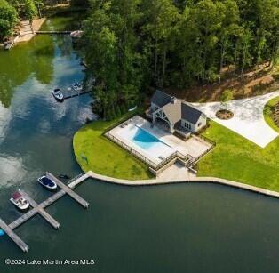 birds eye view of property featuring a water view