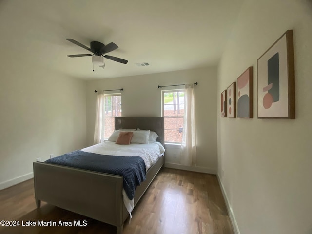 bedroom with wood-type flooring and ceiling fan