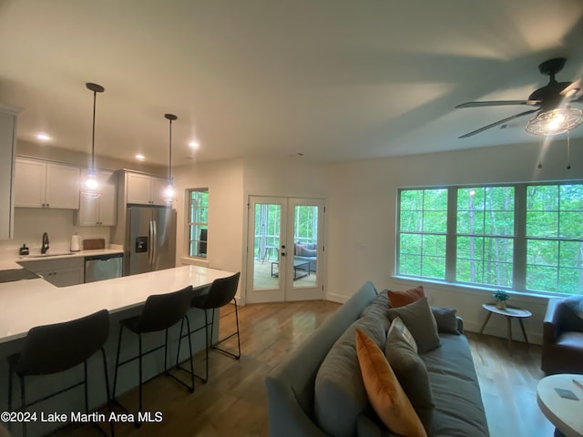 130 Martin Ridge Trce, Tallassee, AL 36078 - living room featuring wood finished floors, ceiling fan, french doors, and recessed lighting