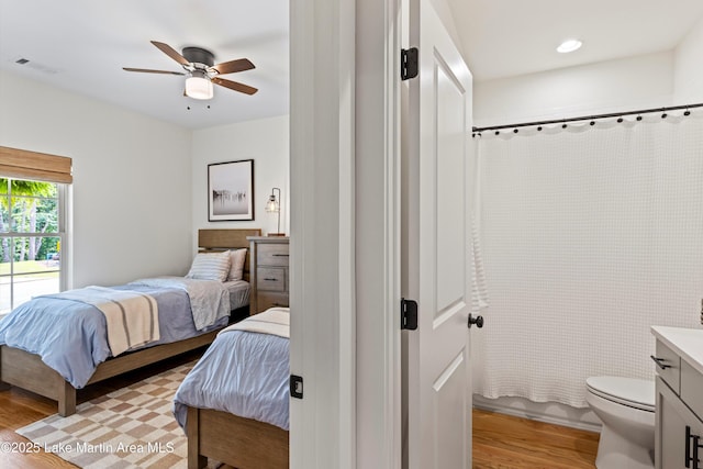 224 Village Trl, Dadeville, AL 36853 - bedroom with light wood-type flooring and ceiling fan