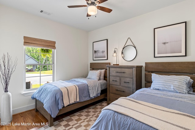 224 Village Trl, Dadeville, AL 36853 - bedroom featuring wood finished floors, baseboards, and ceiling fan