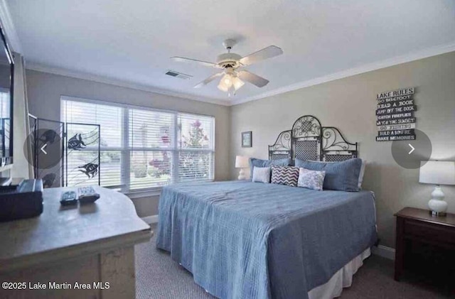 carpeted bedroom with crown molding, visible vents, and baseboards