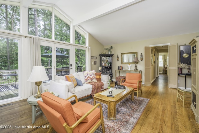 1751 Clubview Dr, Alexander City, AL 35010 - living area featuring plenty of natural light, light wood-type flooring, beamed ceiling, and high vaulted ceiling