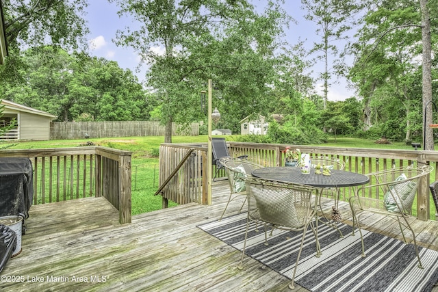 1751 Clubview Dr, Alexander City, AL 35010 - wooden terrace featuring a fenced backyard, outdoor dining space, and view of scattered trees