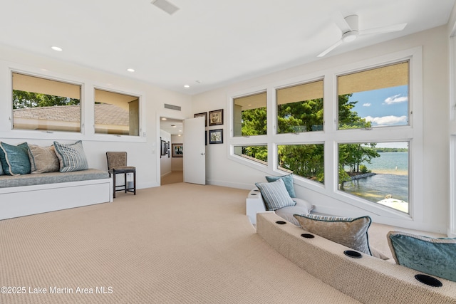 1020 Wake Robin, Eclectic, AL 36024 - interior space featuring a wealth of natural light, light carpet, ceiling fan, and visible vents