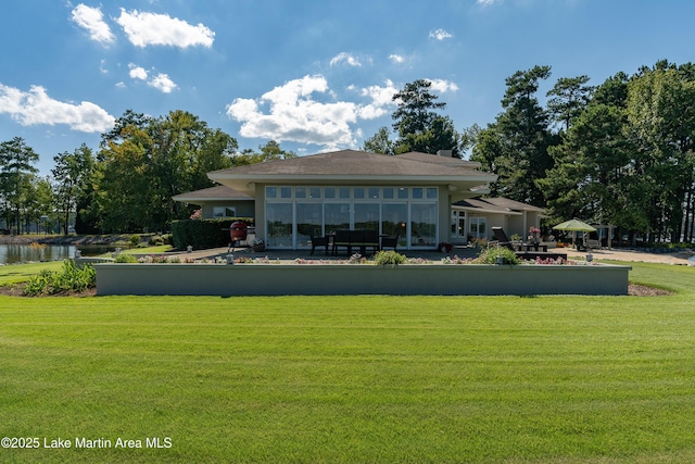 1020 Wake Robin, Eclectic, AL 36024 - back of house with a yard and a water view