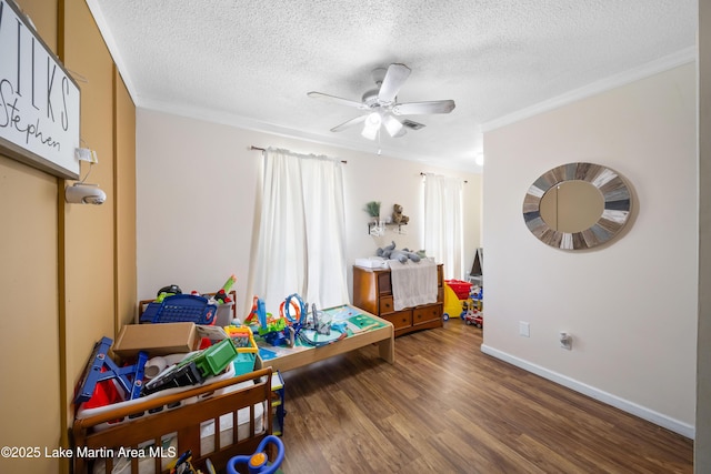 1258 Watson St, Alexander City, AL 35010 - game room with a textured ceiling, crown molding, wood finished floors, and a ceiling fan