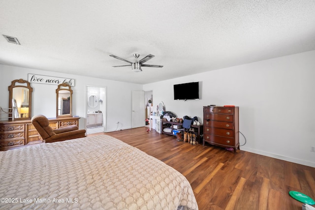 1258 Watson St, Alexander City, AL 35010 - bedroom featuring wood finished floors, a textured ceiling, ensuite bathroom, and ceiling fan