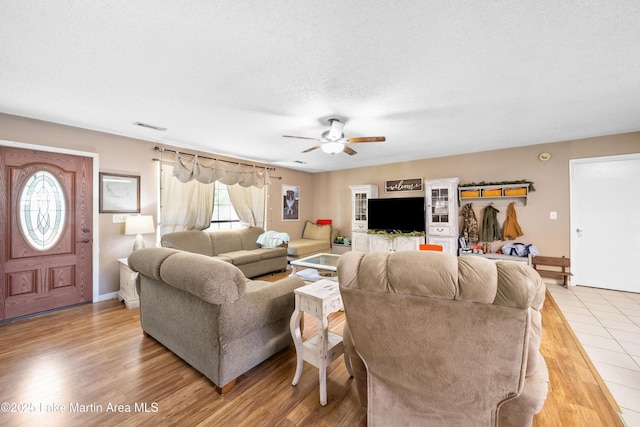 1258 Watson St, Alexander City, AL 35010 - living room featuring a ceiling fan and light wood finished floors