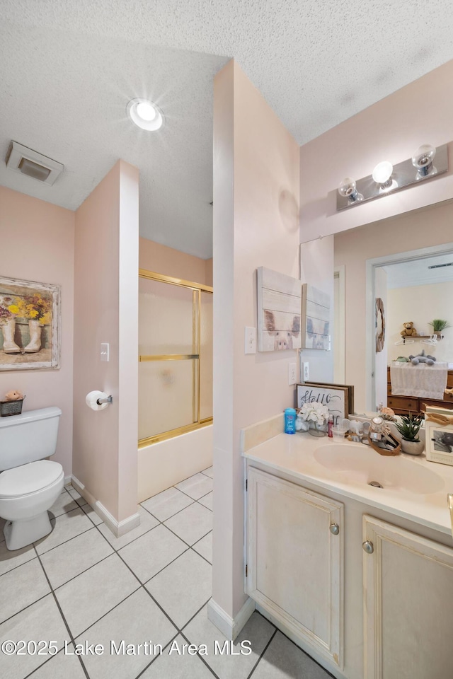 1258 Watson St, Alexander City, AL 35010 - full bath featuring vanity, enclosed tub / shower combo, tile patterned flooring, and a textured ceiling