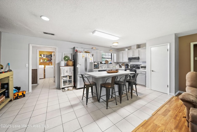 1258 Watson St, Alexander City, AL 35010 - dining area with separate washer and dryer and a textured ceiling