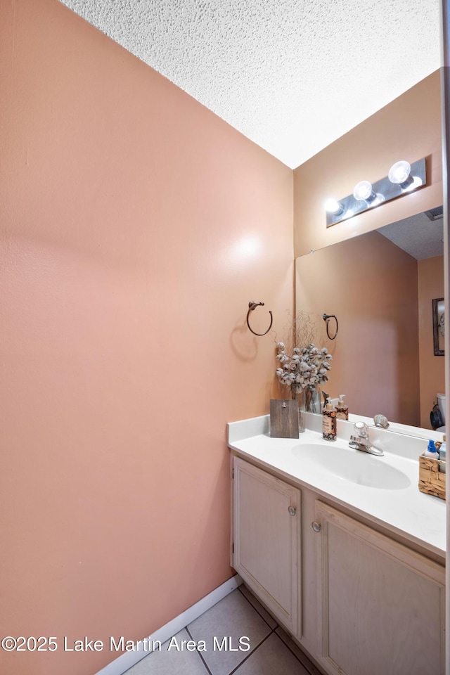 1258 Watson St, Alexander City, AL 35010 - bathroom with vanity and tile patterned flooring
